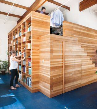 Library And Wardrobe. In a 1,100-square-foot loft in Emeryville, California, Lynda and Peter Benoit designed and built a wooden structure to hold books and keepsakes, store clothes, and house a bedroom. Peter documented the whole design-build process in this three-part series. Photo by Drew Kelly.
